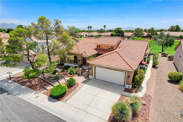 2832 Castle Bar Dr, Las Vegas, NV 89134 - mediterranean / spanish-style house with stucco siding, an attached garage, a tiled roof, concrete driveway, and a mountain view