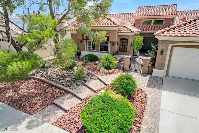 2832 Castle Bar Dr, Las Vegas, NV 89134 - mediterranean / spanish-style home with a gate, stucco siding, a tile roof, and a fenced front yard