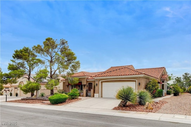 2832 Castle Bar Dr, Las Vegas, NV 89134 - mediterranean / spanish-style house with a tile roof, an attached garage, stucco siding, and concrete driveway