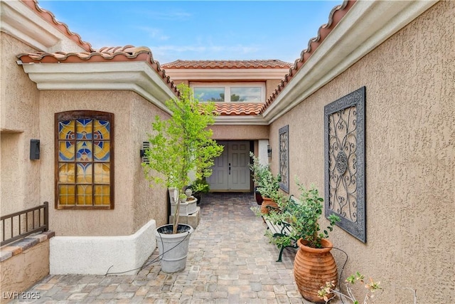 2832 Castle Bar Dr, Las Vegas, NV 89134 - property entrance featuring stucco siding and a tile roof