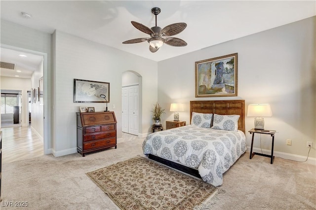 2832 Castle Bar Dr, Las Vegas, NV 89134 - bedroom featuring carpet, a closet, arched walkways, and a ceiling fan