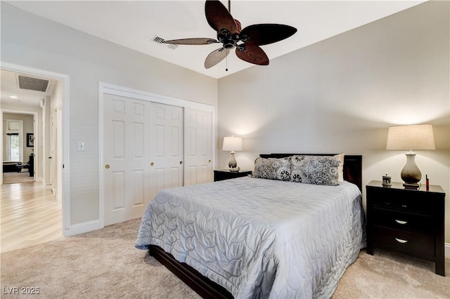 2832 Castle Bar Dr, Las Vegas, NV 89134 - bedroom featuring light colored carpet, a closet, and ceiling fan