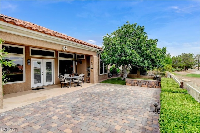 2832 Castle Bar Dr, Las Vegas, NV 89134 - fenced backyard with a patio area and french doors