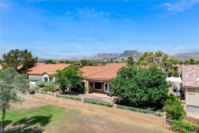 2832 Castle Bar Dr, Las Vegas, NV 89134 - view of front of house with a tile roof, stucco siding, and a mountain view
