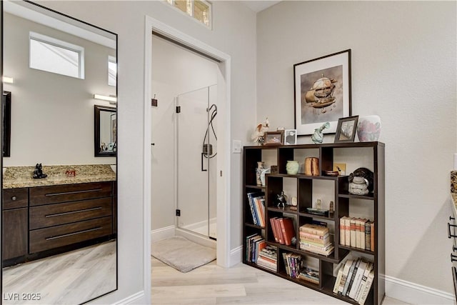 2832 Castle Bar Dr, Las Vegas, NV 89134 - hall with light wood-type flooring and baseboards