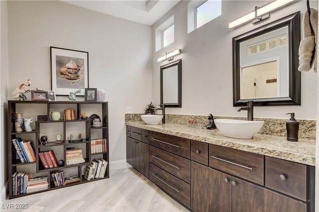 2832 Castle Bar Dr, Las Vegas, NV 89134 - bathroom with double vanity and baseboards