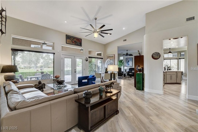 2832 Castle Bar Dr, Las Vegas, NV 89134 - living area with ceiling fan, french doors, light wood finished floors, high vaulted ceiling, and recessed lighting
