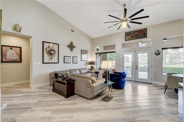 2832 Castle Bar Dr, Las Vegas, NV 89134 - living room featuring a ceiling fan, high vaulted ceiling, french doors, and light wood-style flooring