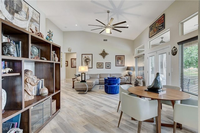 2832 Castle Bar Dr, Las Vegas, NV 89134 - dining room with a ceiling fan, light wood finished floors, high vaulted ceiling, and french doors