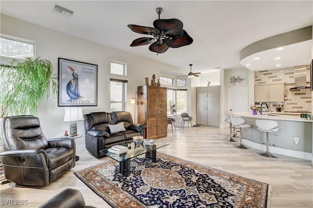 2832 Castle Bar Dr, Las Vegas, NV 89134 - living room featuring ceiling fan and light wood finished floors