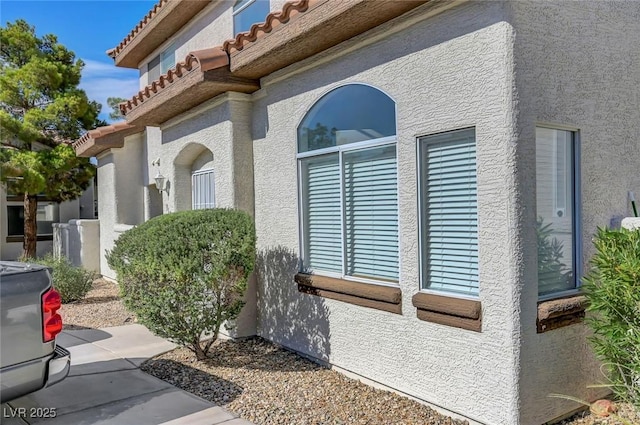 917 Intrigue Way, Las Vegas, NV 89128 - view of home's exterior featuring stucco siding