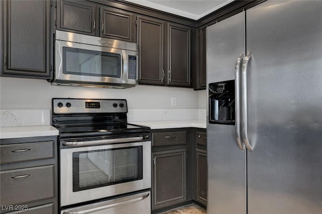 917 Intrigue Way, Las Vegas, NV 89128 - kitchen featuring appliances with stainless steel finishes and light countertops