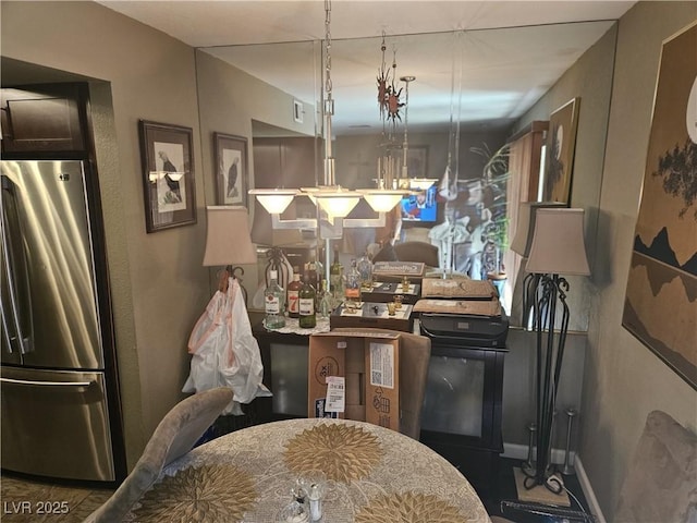 1341 Del Mar St Unit 101, Las Vegas, NV 89119 - kitchen featuring freestanding refrigerator and baseboards