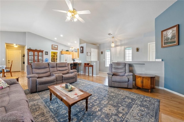 200 E Domingo St, Pahrump, NV 89048 - living area with vaulted ceiling, a ceiling fan, light wood-style flooring, and recessed lighting