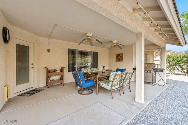 200 E Domingo St, Pahrump, NV 89048 - view of patio featuring a grill, a ceiling fan, and outdoor dining space