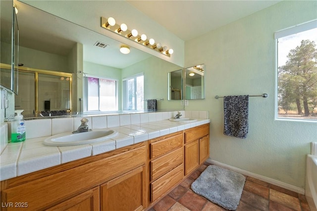 200 E Domingo St, Pahrump, NV 89048 - full bathroom with double vanity, an enclosed shower, and a bathtub