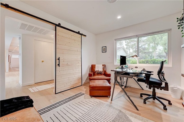 3022 El Camino Ave, Las Vegas, NV 89102 - office area featuring a barn door, light wood-style floors, and recessed lighting
