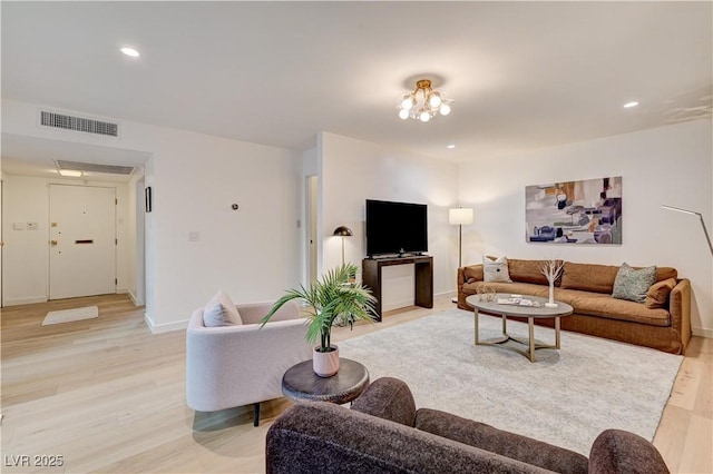 3022 El Camino Ave, Las Vegas, NV 89102 - living room with light wood-style floors and recessed lighting
