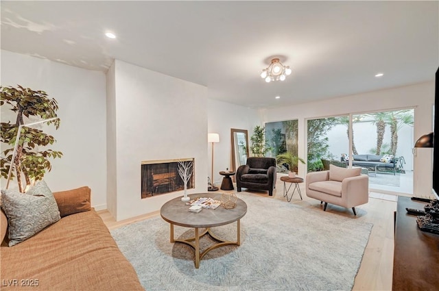 3022 El Camino Ave, Las Vegas, NV 89102 - living area with light wood finished floors, recessed lighting, and a fireplace