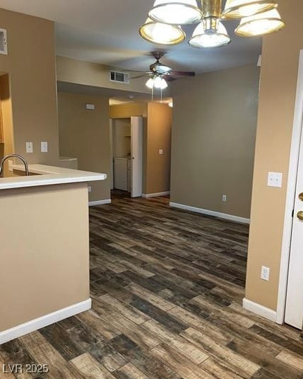 9050 W Warm Springs Rd Unit 1128, Las Vegas, NV 89148 - kitchen with dark wood-style floors, ceiling fan, and light countertops