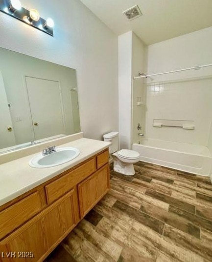 9050 W Warm Springs Rd Unit 1128, Las Vegas, NV 89148 - full bathroom with wood finished floors, vanity, and tub / shower combination