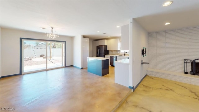 1518 Golden Arrow Dr, Las Vegas, NV 89169 - kitchen featuring refrigerator with ice dispenser, stainless steel dishwasher, light countertops, a chandelier, and recessed lighting