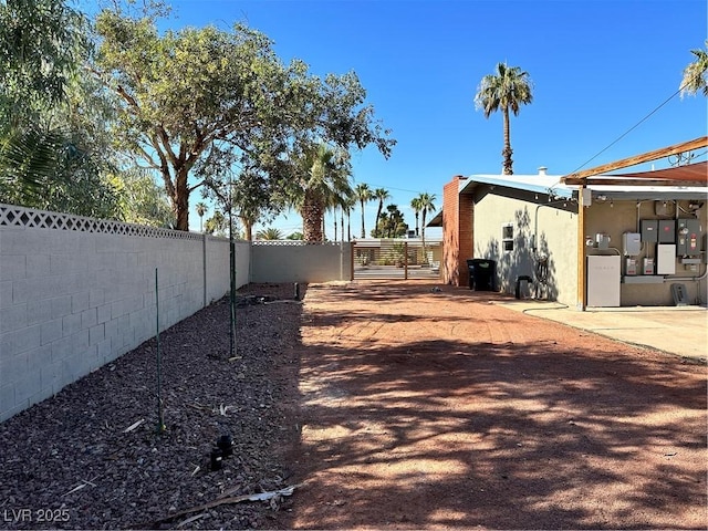 1518 Golden Arrow Dr, Las Vegas, NV 89169 - fenced backyard featuring a patio area