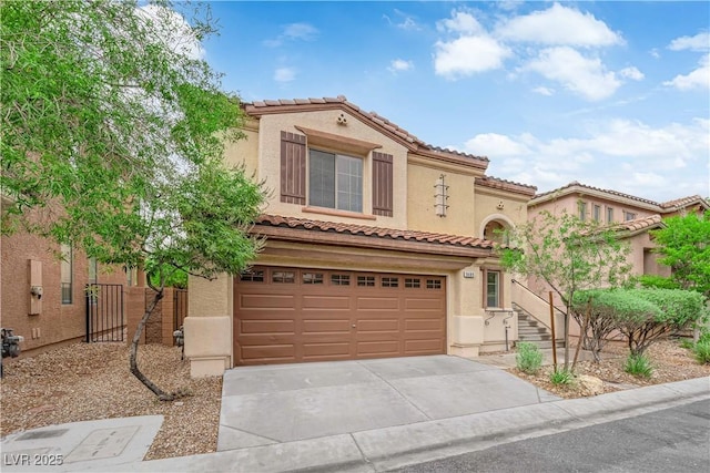 9489 Country Highlands Ct, Las Vegas, NV 89178 - mediterranean / spanish home with an attached garage, driveway, stucco siding, and a tile roof