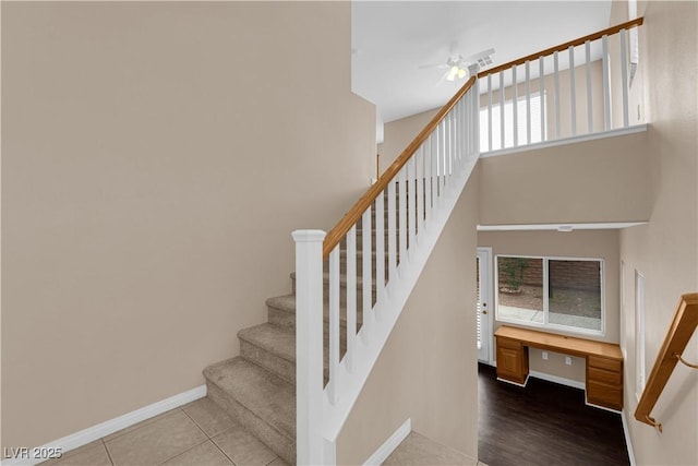 9489 Country Highlands Ct, Las Vegas, NV 89178 - stairs with ceiling fan and built in desk
