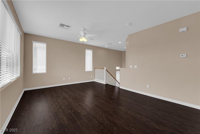 9489 Country Highlands Ct, Las Vegas, NV 89178 - spare room featuring dark wood finished floors, a ceiling fan, healthy amount of natural light, and recessed lighting