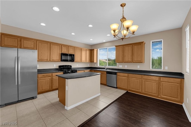 9489 Country Highlands Ct, Las Vegas, NV 89178 - kitchen with black appliances, dark countertops, a chandelier, a center island, and recessed lighting