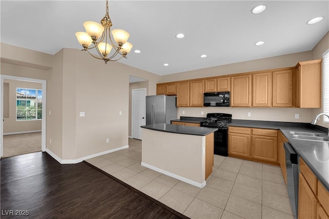 9489 Country Highlands Ct, Las Vegas, NV 89178 - kitchen with black appliances, dark countertops, a chandelier, a kitchen island, and recessed lighting
