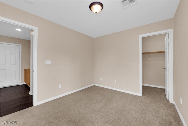 9489 Country Highlands Ct, Las Vegas, NV 89178 - unfurnished bedroom with carpet, a spacious closet, recessed lighting, and a closet