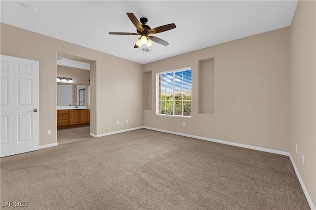 9489 Country Highlands Ct, Las Vegas, NV 89178 - unfurnished bedroom with light carpet, ensuite bath, and a ceiling fan