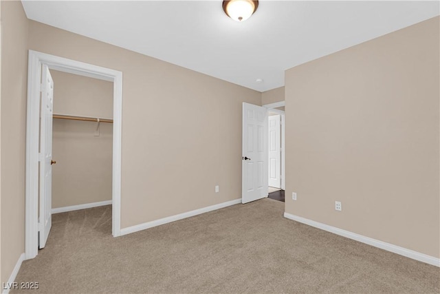 9489 Country Highlands Ct, Las Vegas, NV 89178 - unfurnished bedroom featuring carpet flooring, a walk in closet, and a closet