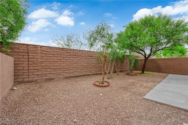 9489 Country Highlands Ct, Las Vegas, NV 89178 - fenced backyard featuring a patio
