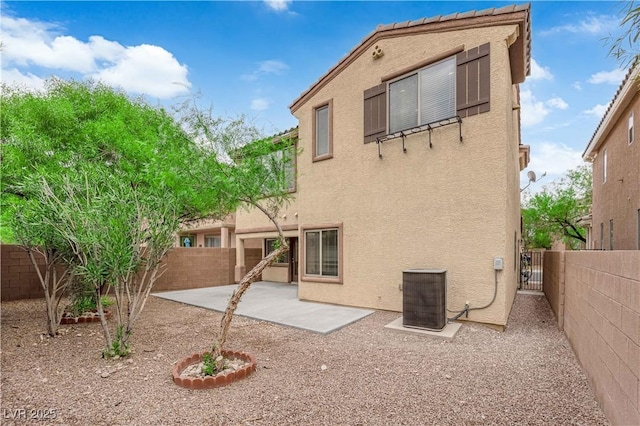 9489 Country Highlands Ct, Las Vegas, NV 89178 - back of property with stucco siding, a fenced backyard, and a patio area