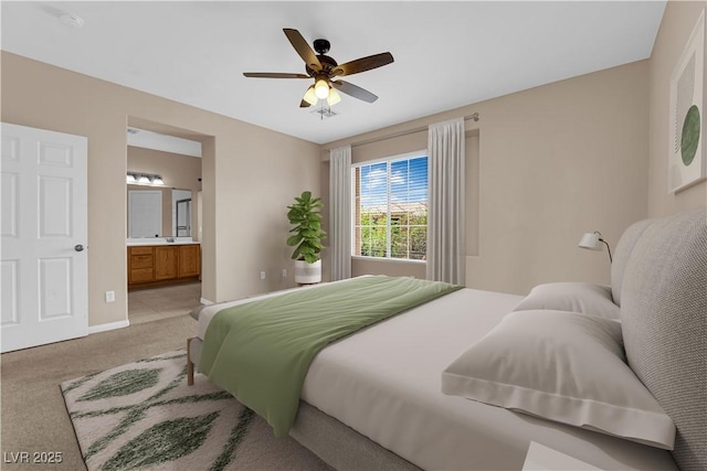 9489 Country Highlands Ct, Las Vegas, NV 89178 - bedroom with light colored carpet, ensuite bathroom, and ceiling fan