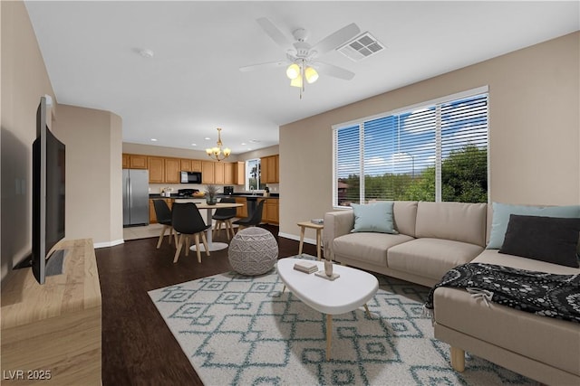 9489 Country Highlands Ct, Las Vegas, NV 89178 - living room with a chandelier, light wood-type flooring, a ceiling fan, and recessed lighting