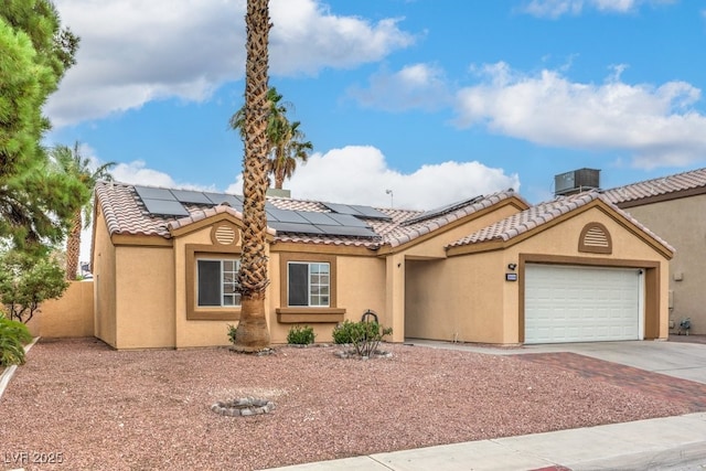 4006 Clove Tree Ct, North Las Vegas, NV 89031 - view of front of home featuring a tiled roof, driveway, and stucco siding