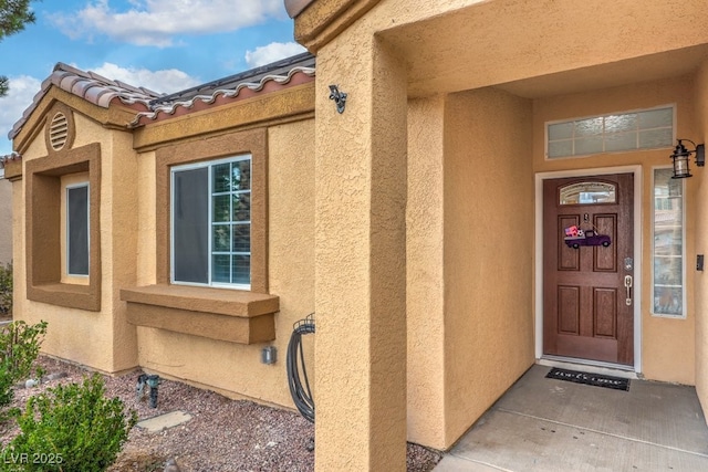 4006 Clove Tree Ct, North Las Vegas, NV 89031 - doorway to property featuring stucco siding