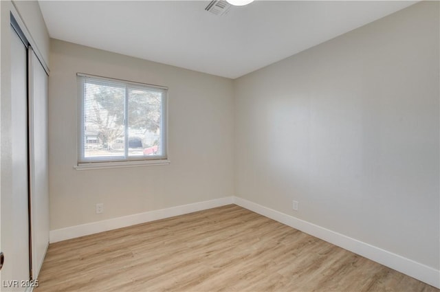 4512 Mark Ave, Las Vegas, NV 89108 - unfurnished bedroom with light wood-style floors and a closet
