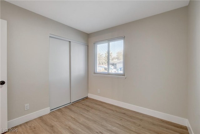 4512 Mark Ave, Las Vegas, NV 89108 - unfurnished bedroom with light wood-type flooring and a closet
