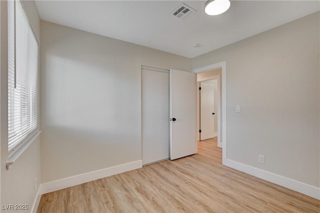 4512 Mark Ave, Las Vegas, NV 89108 - unfurnished bedroom featuring light wood-style floors and a closet