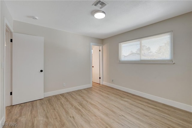 4512 Mark Ave, Las Vegas, NV 89108 - unfurnished room featuring light wood-style flooring and a smoke detector