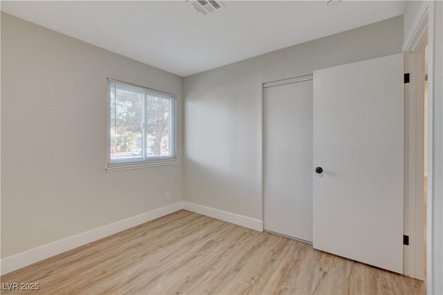 4512 Mark Ave, Las Vegas, NV 89108 - unfurnished bedroom featuring wood finished floors and a closet