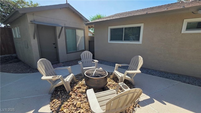 4512 Mark Ave, Las Vegas, NV 89108 - view of patio with a fire pit and an outdoor structure