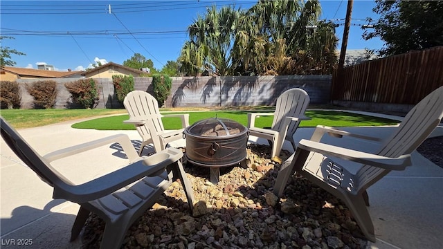 4512 Mark Ave, Las Vegas, NV 89108 - fenced backyard featuring a fire pit and a patio area