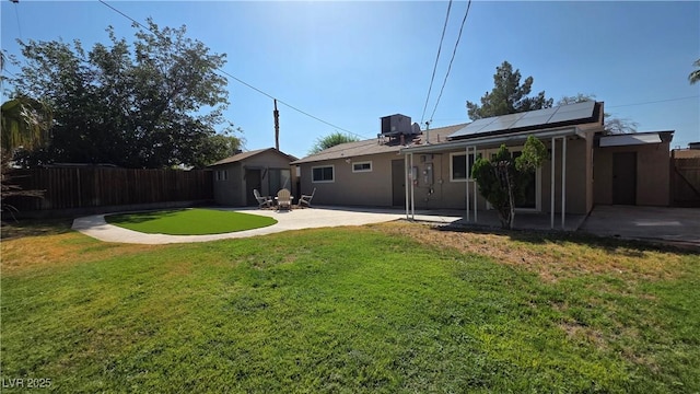4512 Mark Ave, Las Vegas, NV 89108 - back of house featuring a patio, a fenced backyard, solar panels, and stucco siding