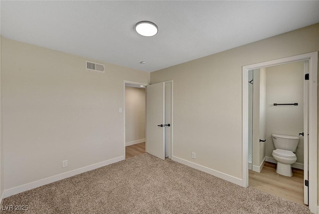 4804 Apawana Ln, Las Vegas, NV 89108 - unfurnished bedroom with light carpet and ensuite bathroom